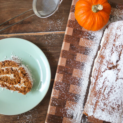 slice of pumpkin cake roll with whipped cream cheese frosting