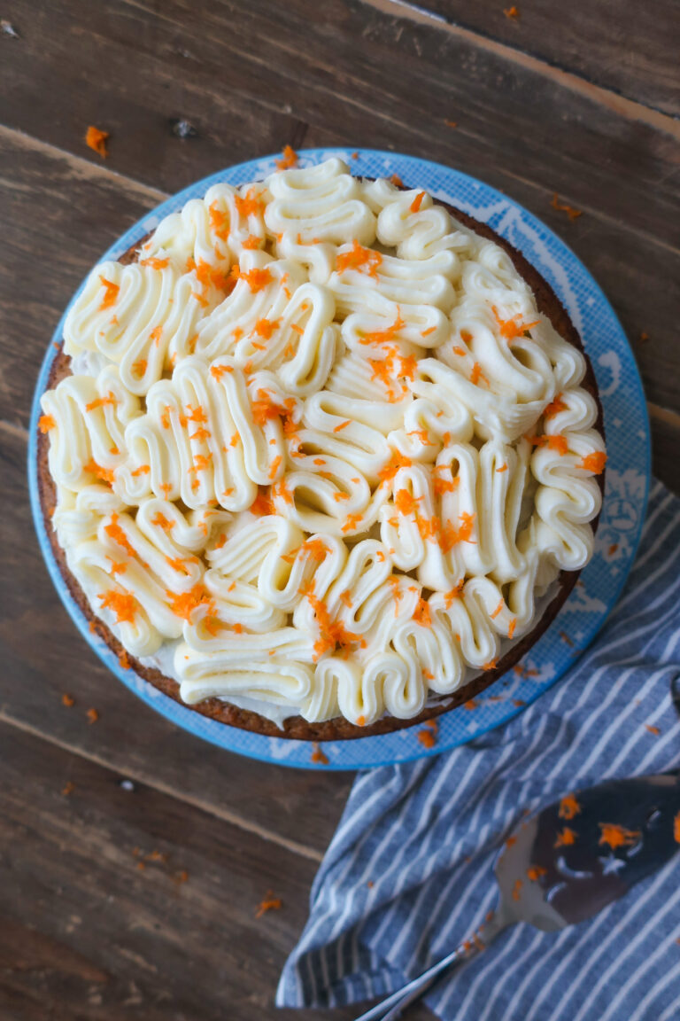 decorated nut and fruit free carrot cake with brown butter cream cheese frosting