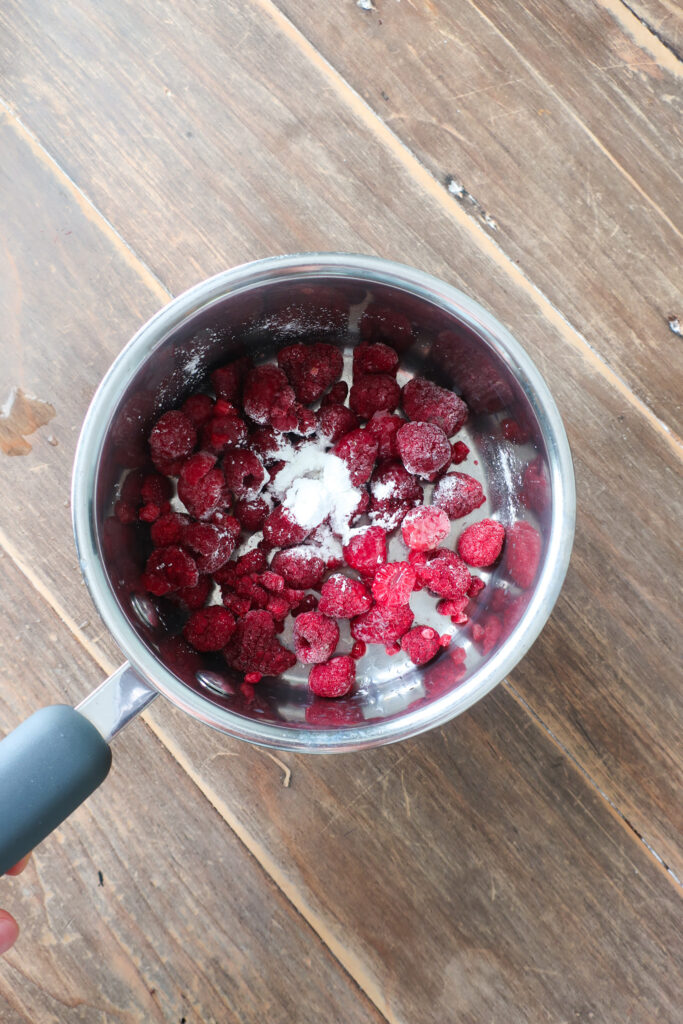 ingredients in pot for raspberry glaze