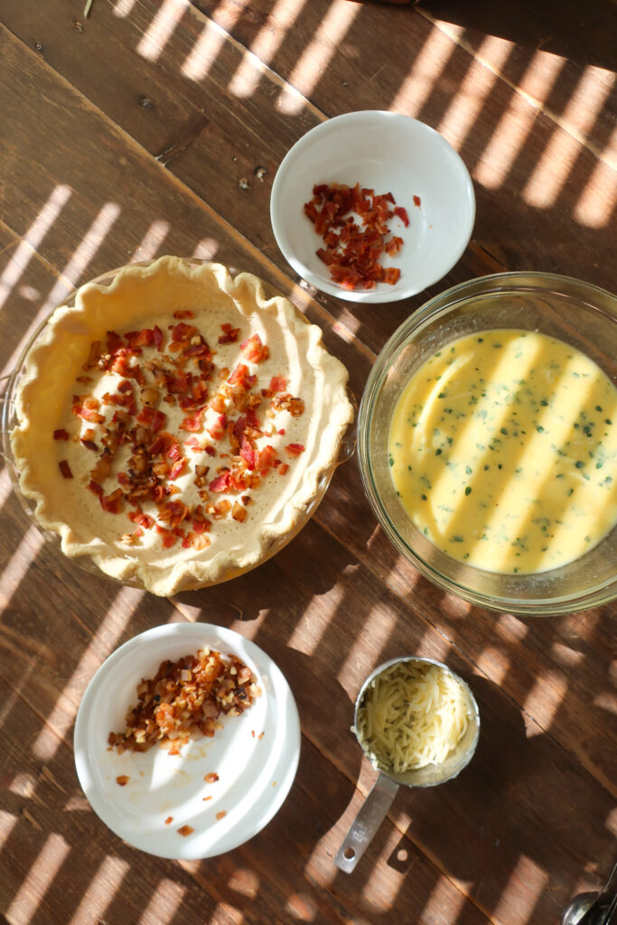 ingredients that make up the layers in quiche lorraine with bacon and swiss cheese and gruyere