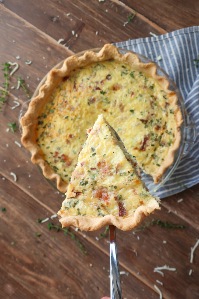 slice of quiche lorraine with bacon and swiss cheese and gruyere