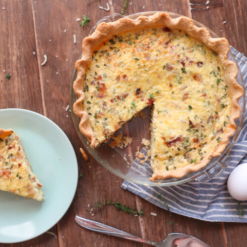 slice of quiche lorraine with bacon and swiss cheese and gruyere