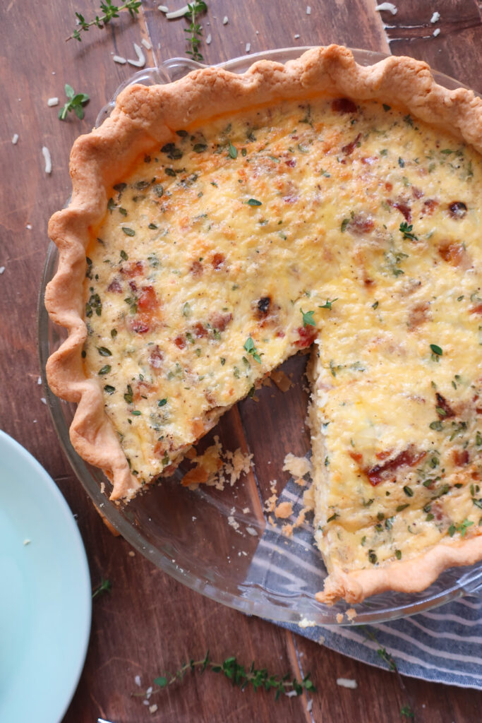 slice of quiche lorraine with bacon and swiss cheese and gruyere