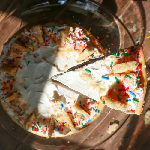 slice of Funfetti cheesecake with shortbread crust