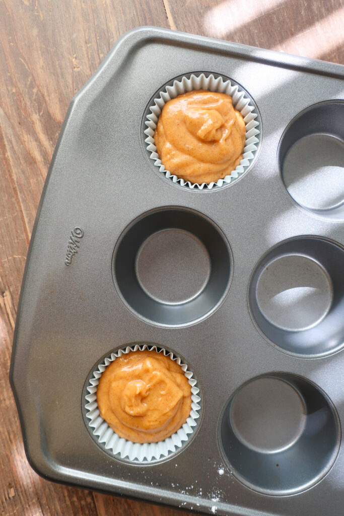 single serve pumpkin cupcakes batter in cupcake liners