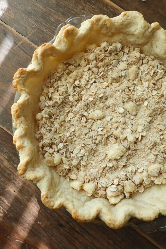 streusel in base of par-baked pie crust for apple streusel pie