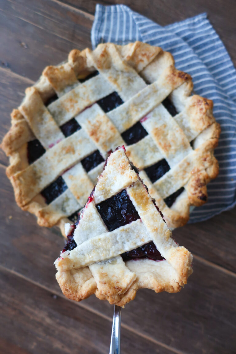 slice of baked cherry pie with lattice crust