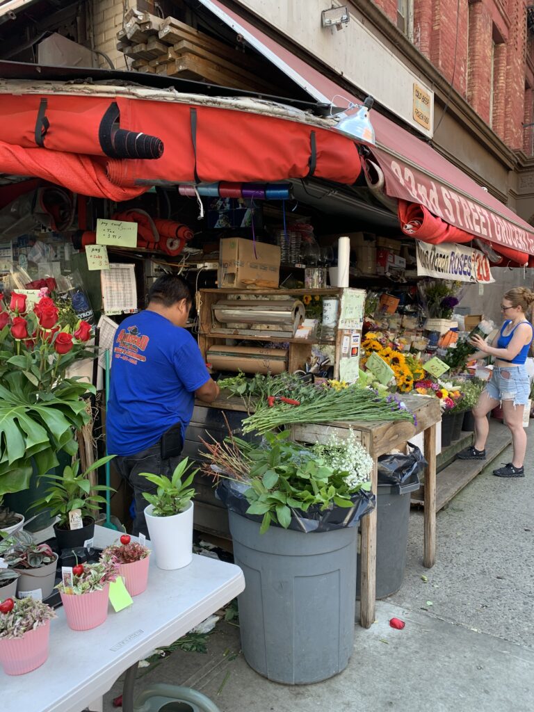 grocery convenience store with flower shop in upper west side new york city; summer in new york city