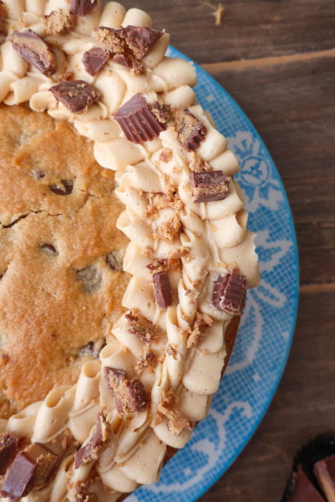 peanut butter and chocolate chip cookie cake with peanut butter buttercream frosting