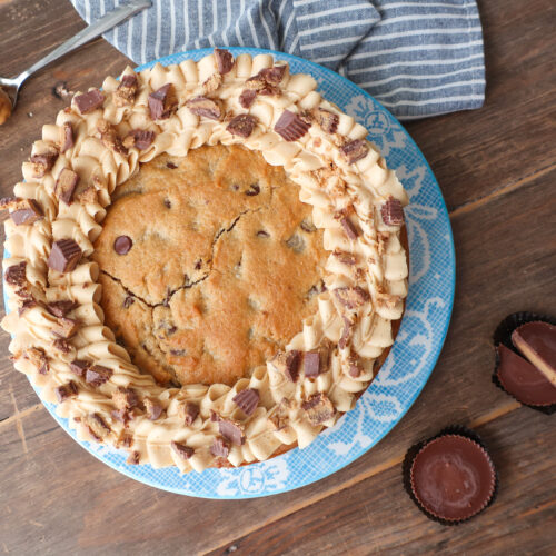 peanut butter and chocolate chip cookie cake with peanut butter buttercream frosting