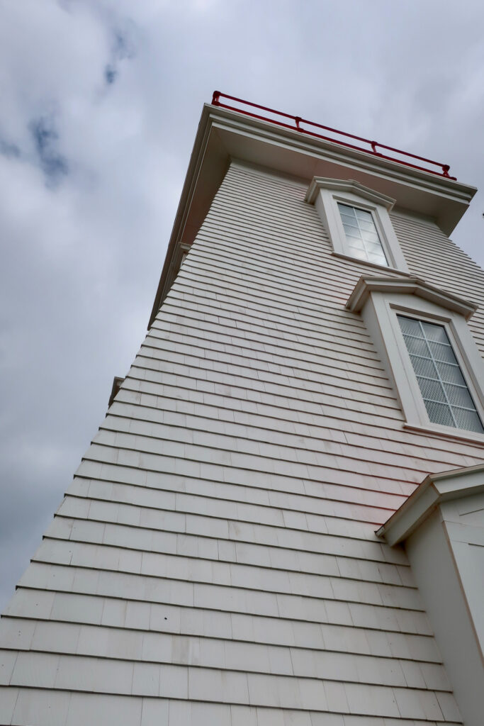 light house on prince edward island in canada; mother daughter trip; canada road trip; red cliffs on prince edward island