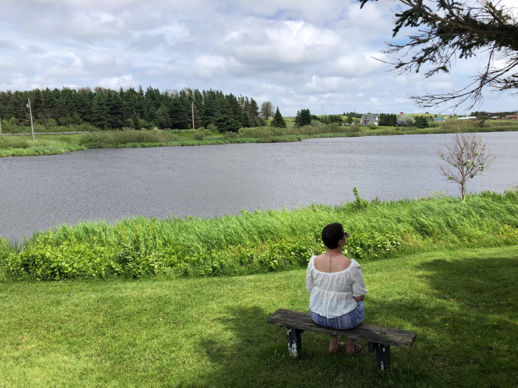 woman in canada; anne of green gables; Lucy Maud Montgomery childhood home on prince edward island in canada; anne of green gables fan; anne of green gables museum