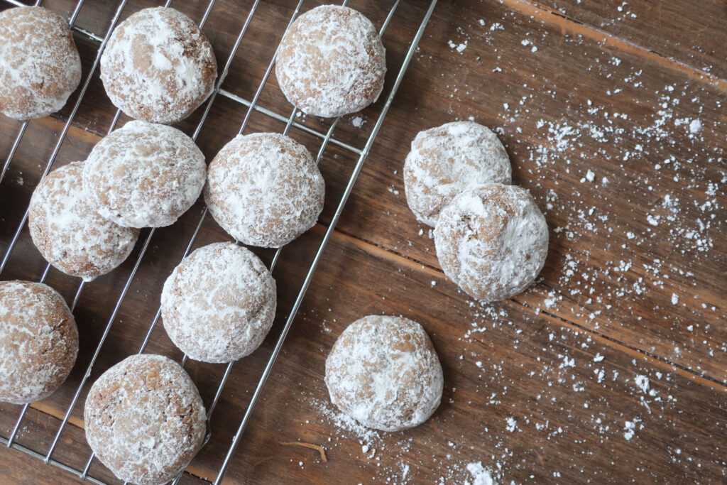 german Pfeffernüsse cookies; german spiced cookies dusted with powdered sugar