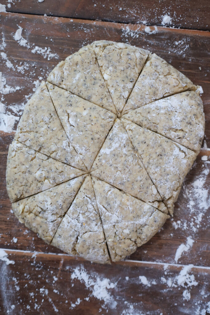 flattened, rolled, and cut dough for scones; baking ingredients for scones; earl grey scones; lemon scones; sweet breakfast brunch recipe earl grey lemon scones with white chocolate lemon glaze