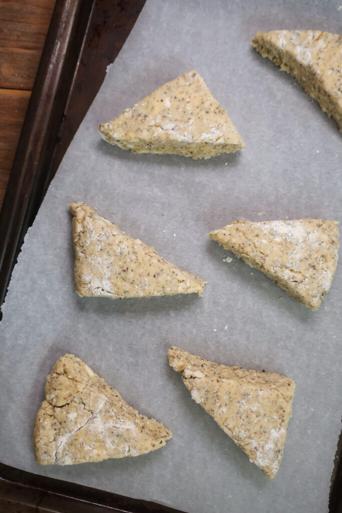 triangle cut dough for scones; baking ingredients for scones; earl grey scones; lemon scones; sweet breakfast brunch recipe earl grey lemon scones with white chocolate lemon glaze