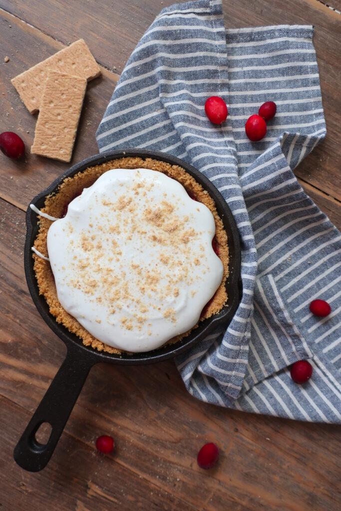 mini graham cracker crust, graham cracker crust in mini cast iron skillet, graham cracker crust for single serve cranberry pie with fresh whipped cream topping, cranberry compote, single serve dessert, single serve pie