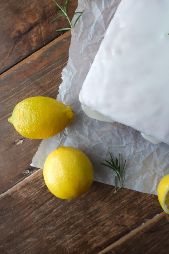 lemon rosemary loaf cake with lemon rosemary simple syrup and lemon glaze