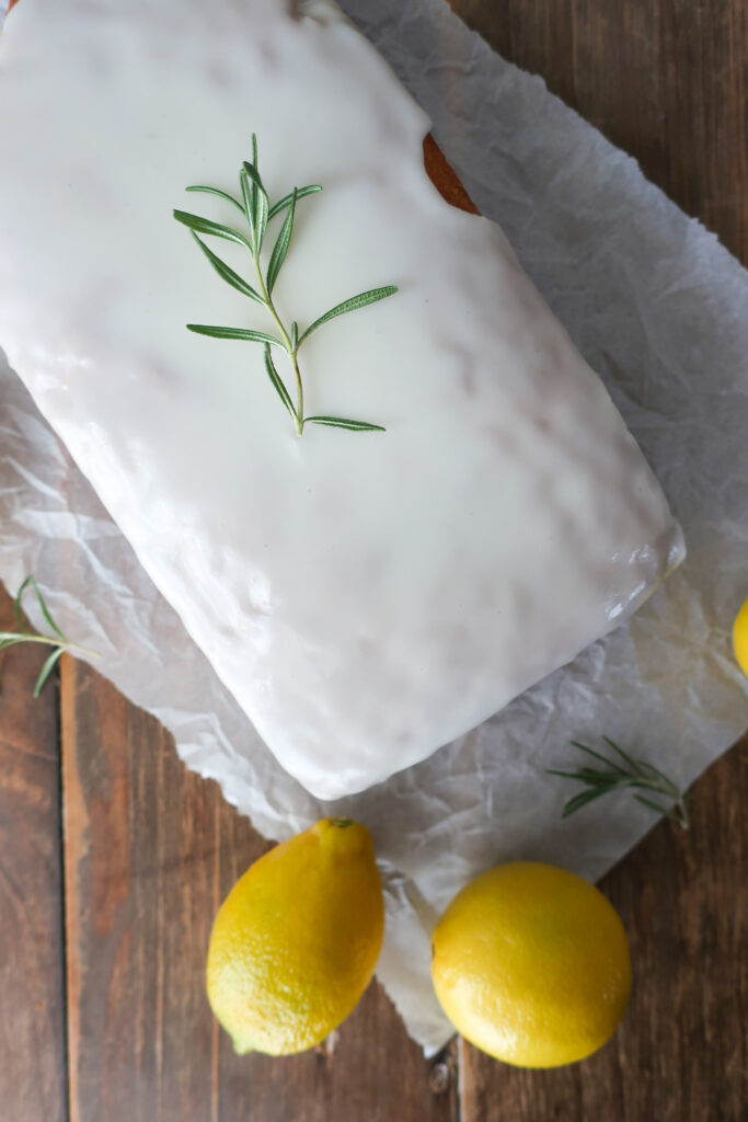 lemon rosemary loaf cake with lemon rosemary simple syrup and lemon glaze