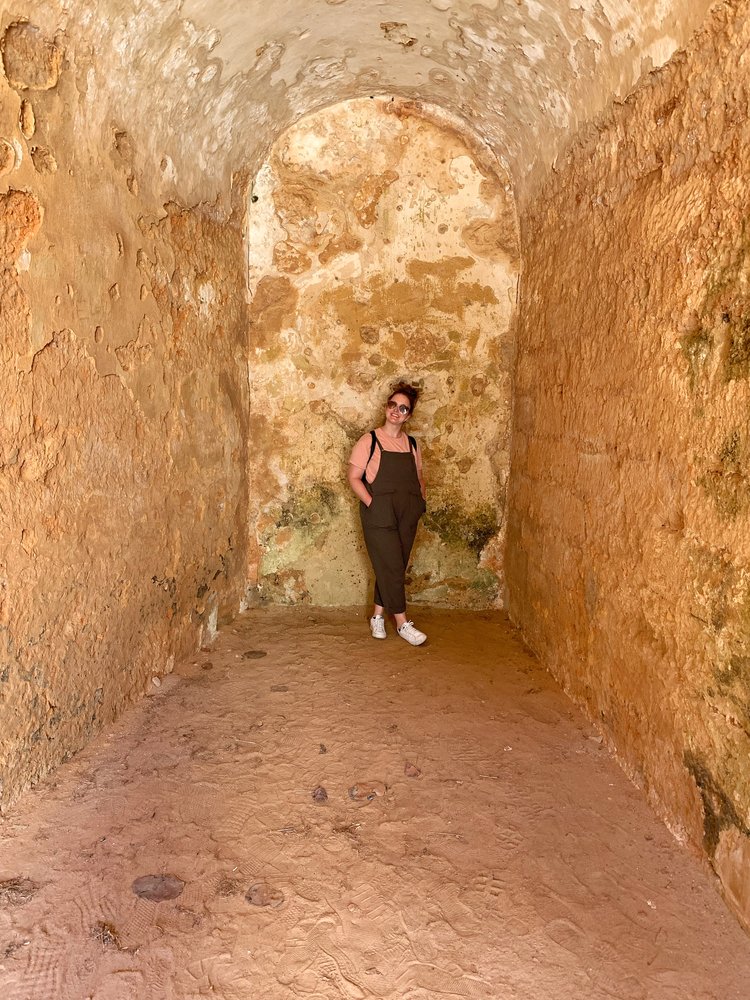 woman against wall in san juan national historic site in puerto rico, usa, north america; friend trip; puerto rico in february; puerto rico itinerary; san juan puerto rico; women who travel; female travel; long week trip inspiration