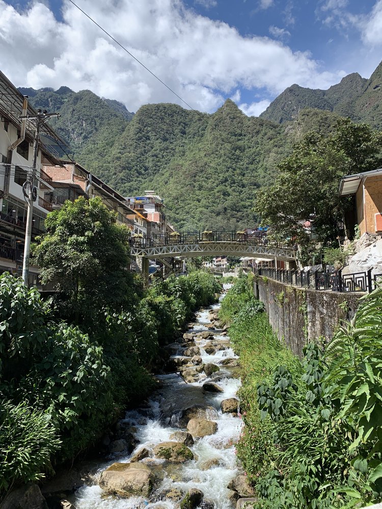 water river view in aguas caliente near machu picchu; solo female travel; solo backpacking; backpacking south america; backpacking tips; peru itinerary;