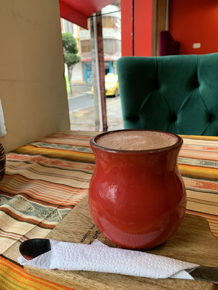 hot chocolate cocoa in banos ecuador, south america; hostel bunkbed views in quito ecuador; solo female travel; solo backpacking; backpacking south america; backpacking tips; peru itinerary;