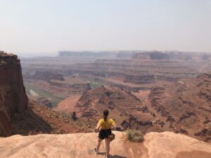 woman looking out over canyonlands national park in utah, usa; mother daughter trip; road trip south west; south west usa; utah travel itinerary; road trip tips; female travel; united states national park trip