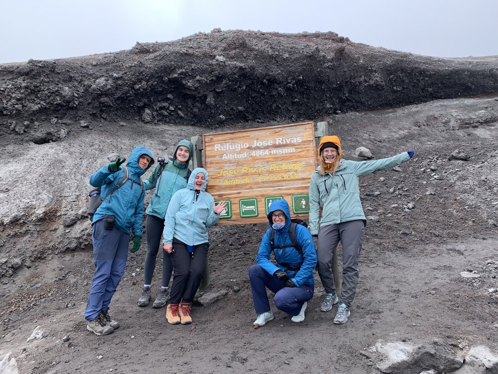 group of people making it to base camp of cotopaxi volcano in cotopaxi ecuador, south america; solo female travel; solo backpacking; backpacking south america; backpacking tips; ecuador itinerary;