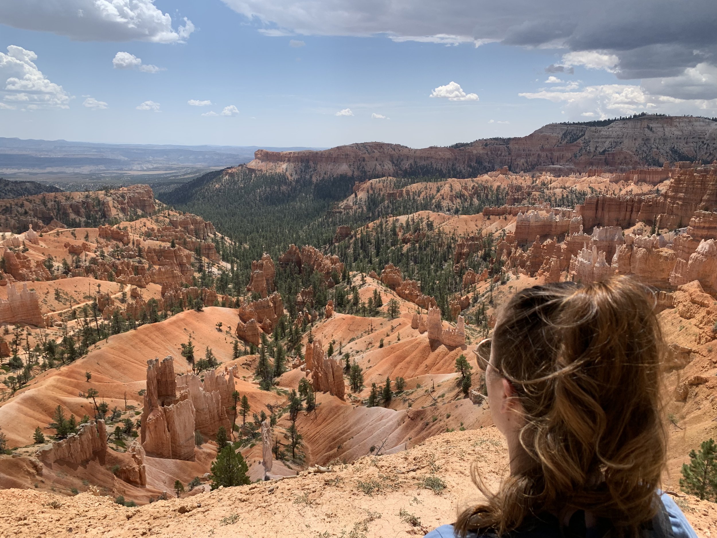 woman looking out over bryce national park, utah, usa; mother daughter trip; road trip south west; south west usa; utah travel itinerary; road trip tips; female travel; united states national park trip