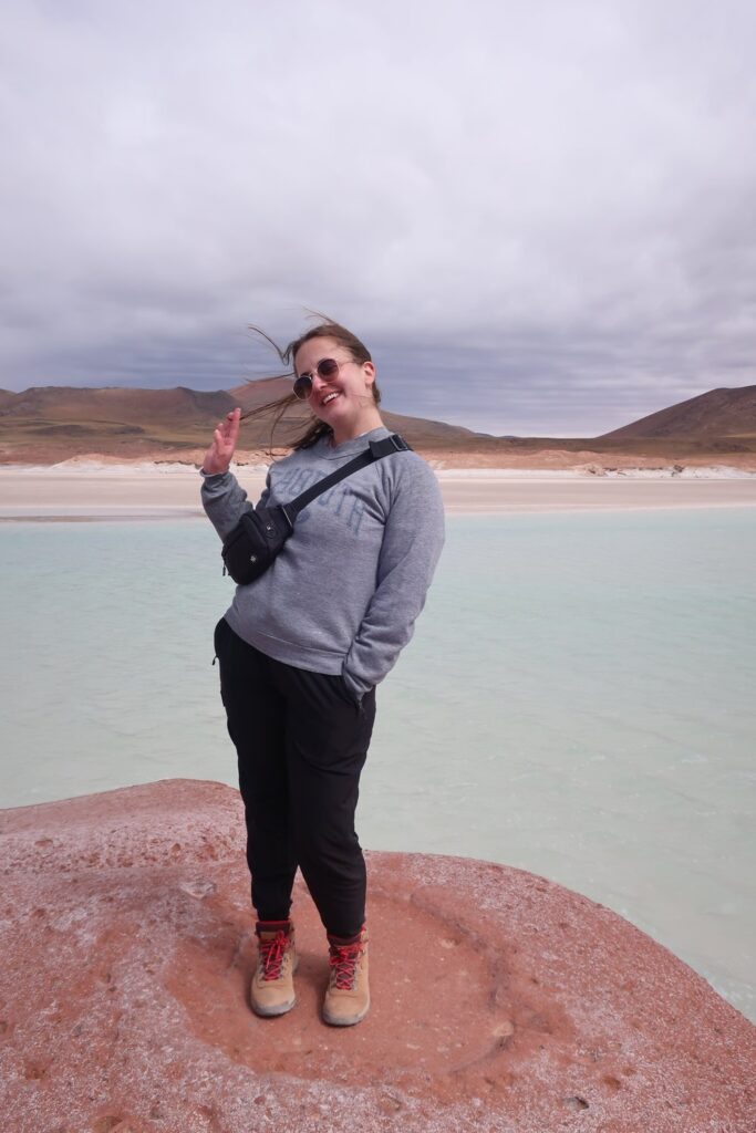 woman on rock in san pedro de atacama chile south america; torres del paine national park chile south america; solo female travel; solo backpacking; backpacking south america; backpacking tips; chile itinerary;