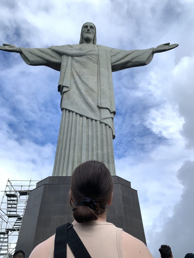 woman looking up at the christ the redeemer statue in Rio de Janeiro, Brazil; backpacking south america; solo backpacking trip; female backpacking trip tips; solo travel tips; solo female travel; brazil travel itinerary