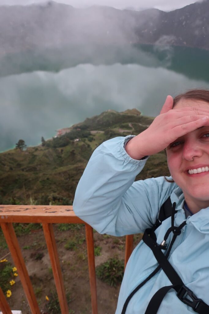 woman looking over quilotoa lake in latacunga, ecuador, south america; solo female travel; solo backpacking; backpacking south america; backpacking tips; peru itinerary;