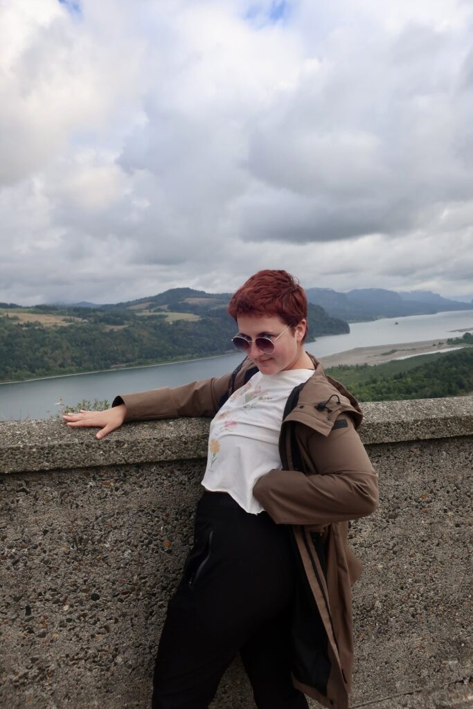 woman making goofy pose near the columbia river gorge in oregon, usa, north america; pacific northwest trip; solo travel; solo female travel; roadtrip usa