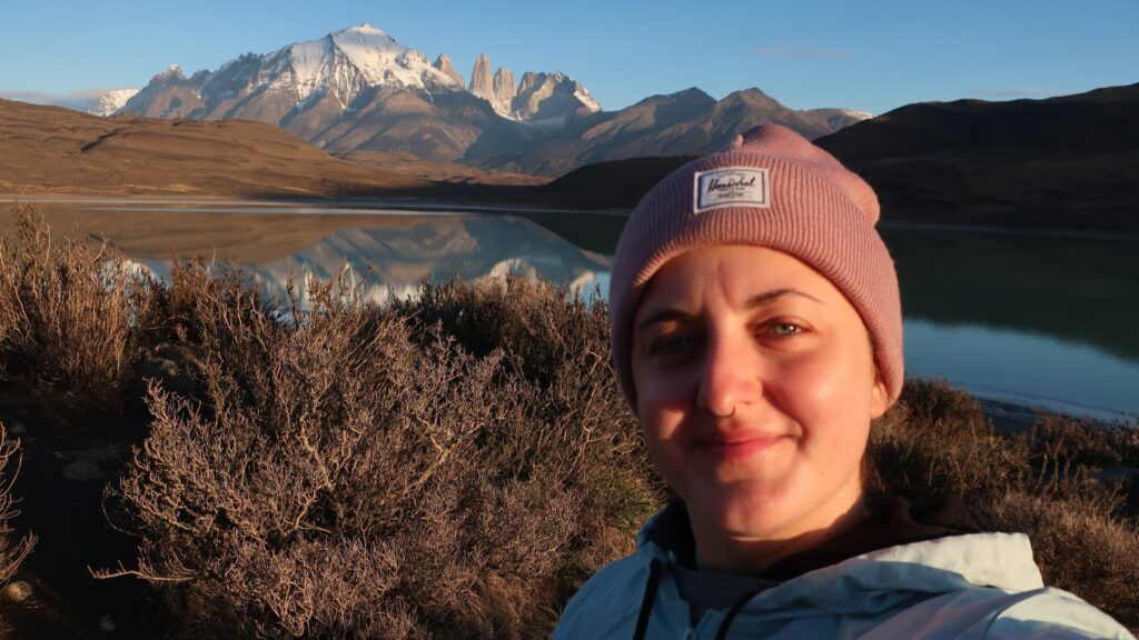 woman in torres del paine national park in chile; backpacking south america; solo backpacking trip; female backpacking trip tips; solo travel tips; solo female travel; chile travel itinerary