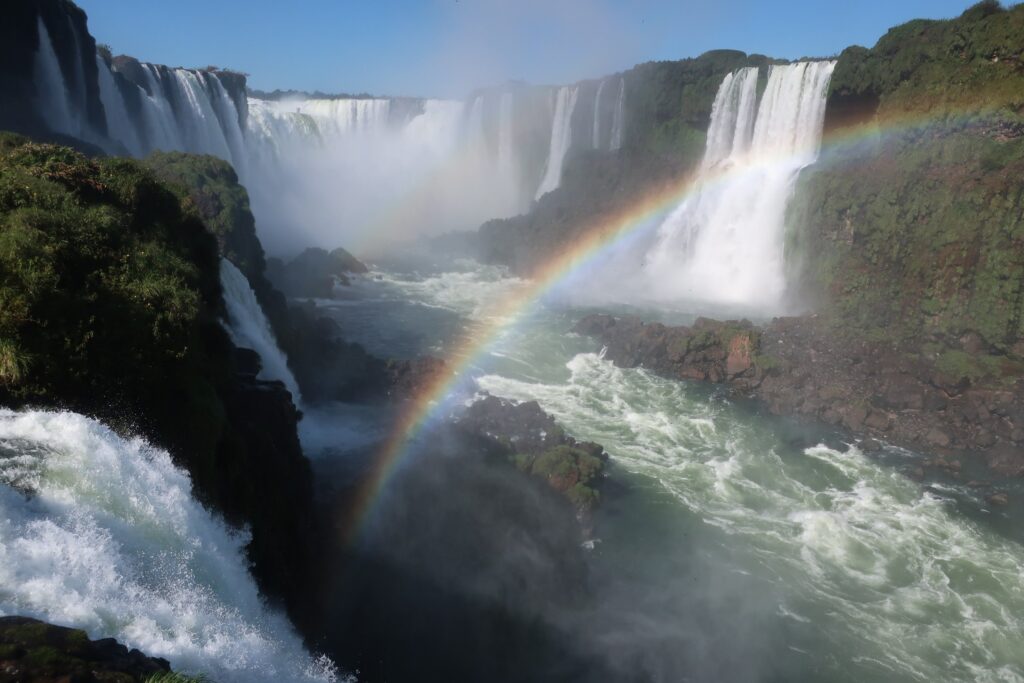 rainbow over the iguazu falls; Brazilian view of iguazu falls in argentina and brazil; backpacking south america; solo backpacking trip; female backpacking trip tips; solo travel tips; solo female travel; argentina travel itinerary