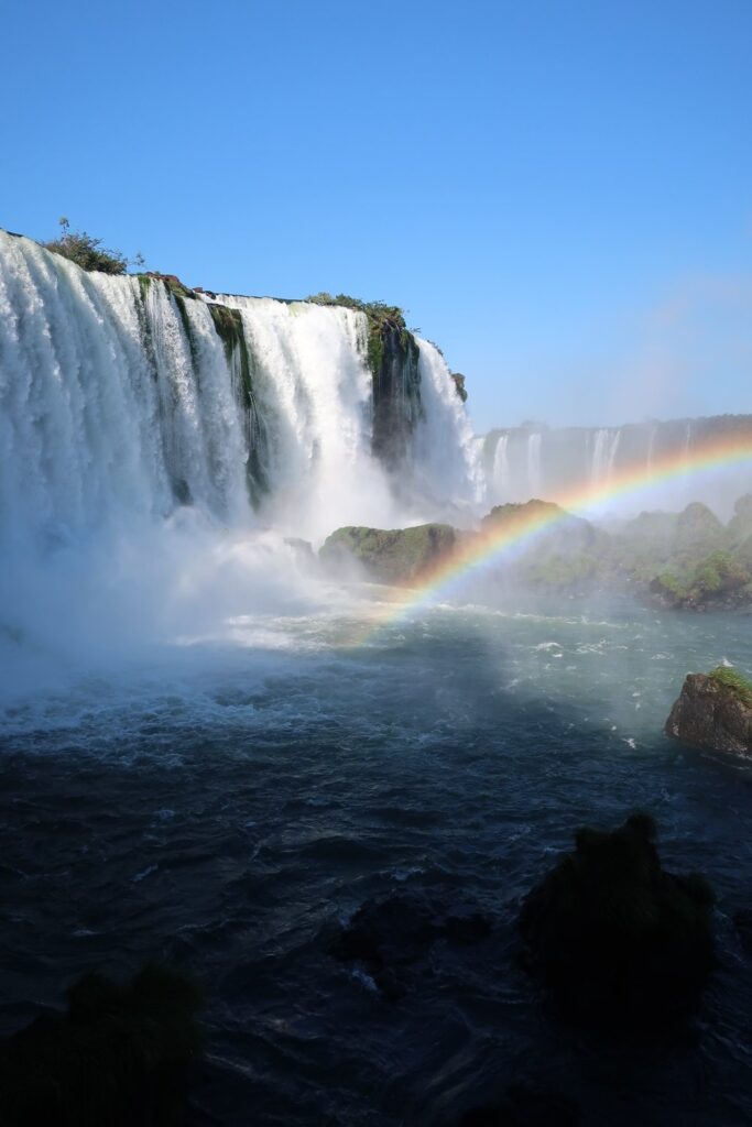 rainbow over the iguazu falls; Brazilian view of iguazu falls in argentina and brazil; backpacking south america; solo backpacking trip; female backpacking trip tips; solo travel tips; solo female travel; argentina travel itinerary