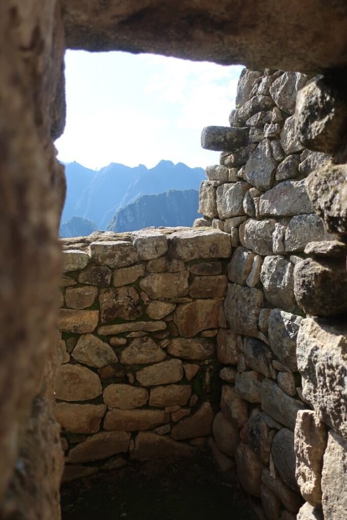 inside building in machu picchu in peru, south america; solo female travel; solo backpacking; backpacking south america; backpacking tips; peru itinerary;