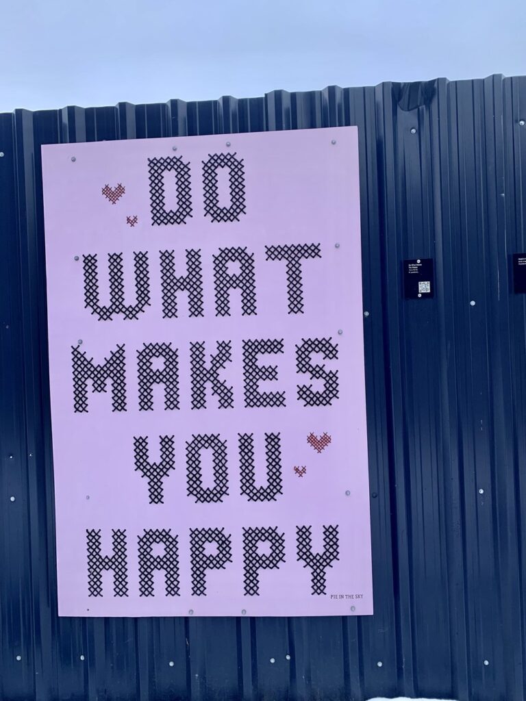 do what makes you happy written on sign hanging in glasgow, scotland; motivational quotes; motivational sign; positive sign; positive affirmation