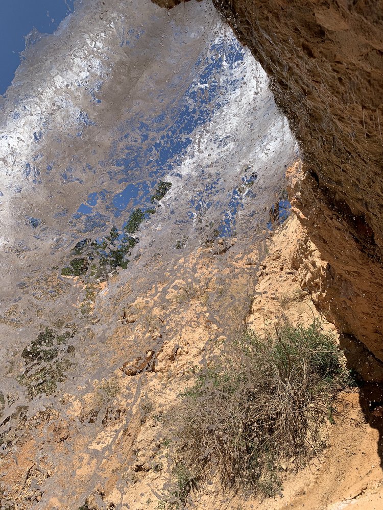 standing under the waterfall in bryce national park in utah, usa; mother daughter trip; road trip south west; south west usa; utah travel itinerary; road trip tips; female travel; united states national park trip