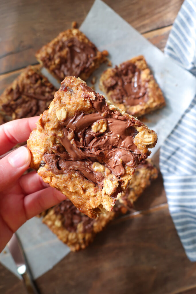 Nutella date oatmeal bars with swirls of Nutella on top