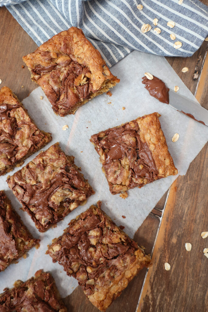 Nutella date oatmeal bars with swirls of Nutella on top