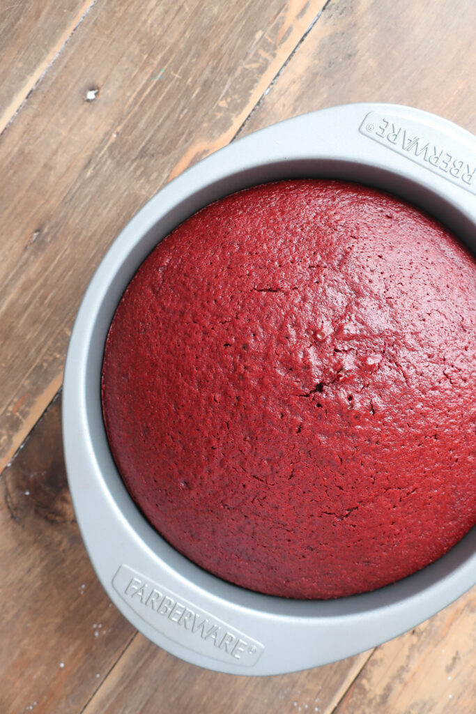 baked cake in pan for red velvet cake with cream cheese frosting