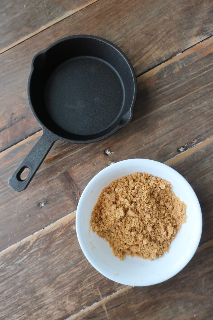 mini cast iron skillet, ingredients for graham cracker crust, mini single-serve key lime cheesecake with whipped cream topping