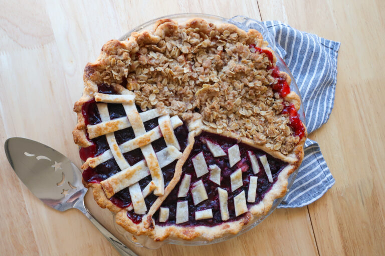 baked quarter pie, sections of pie filled with filling and topped with cinnamon streusel and crust, how to make one pie with four flavors, apple pie, blueberry pie, strawberry pie, cherry pie, crumble topping