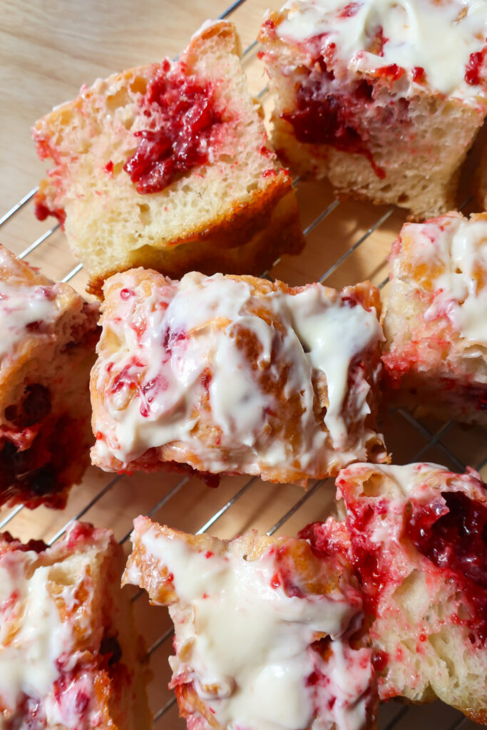 strawberry jam filling focaccia holes covered in cream cheese glaze, no-knead focaccia, one focaccia two flavors, strawberry cheesecake focaccia