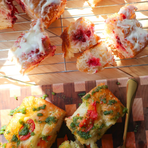 strawberry jam filling focaccia holes covered in cream cheese glaze, no-knead focaccia, one focaccia two flavors, tomato pesto focaccia, strawberry cheesecake focaccia