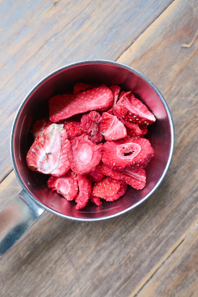 freeze-dried strawberries in metal measuring cup