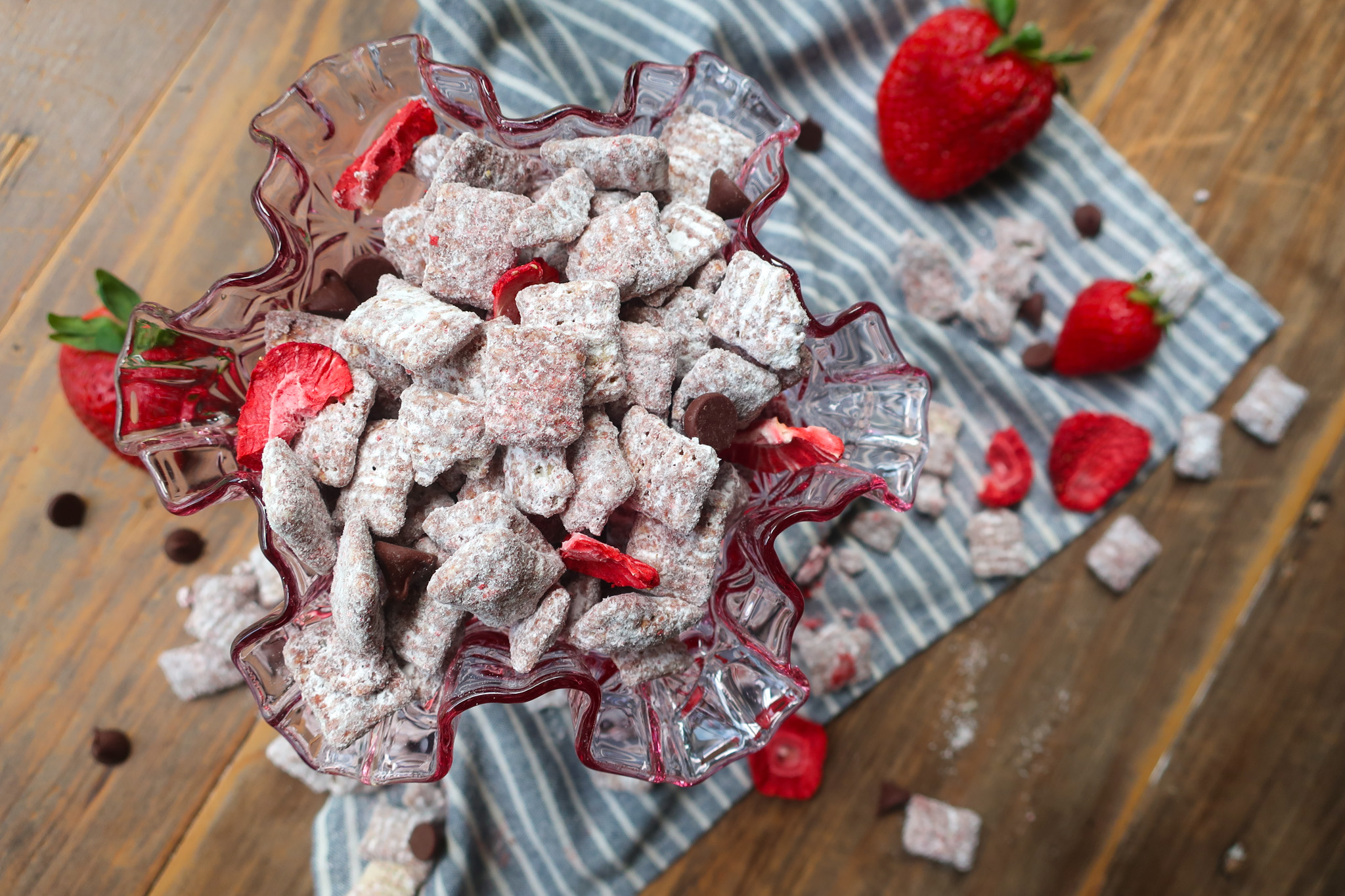 birds eye view of chocolate strawberry puppy chow in pink glass
