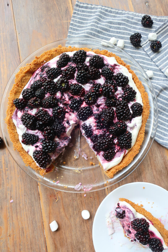 slice of pie next to blackberry pie