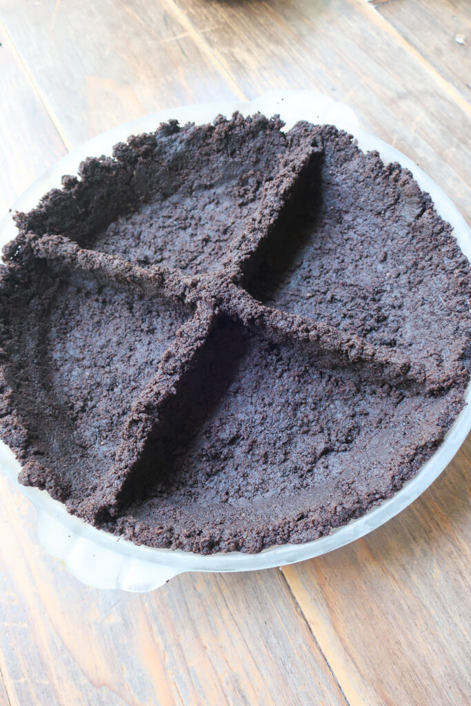 crust sectioned for four flavors in pie dish for no bake oreo crust pie