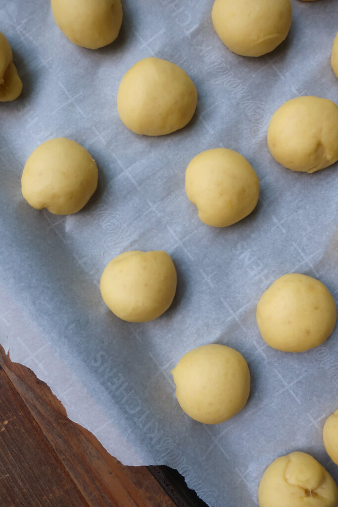 shaped donut hole dough on tray